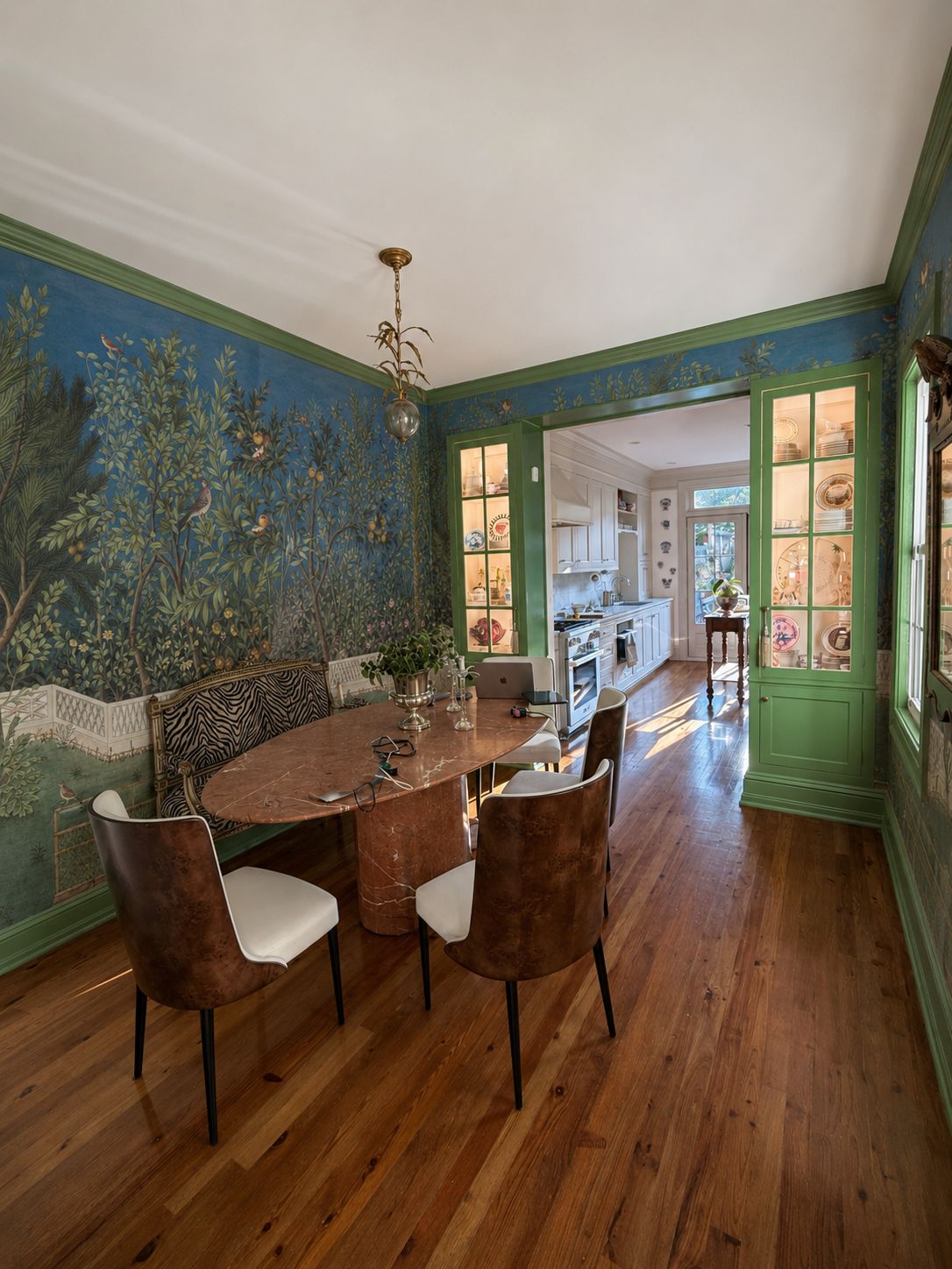 Georgetown dining room with hand-painted garden mural walls and green glass-front cabinetry